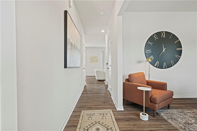 hallway with dark hardwood / wood-style floors