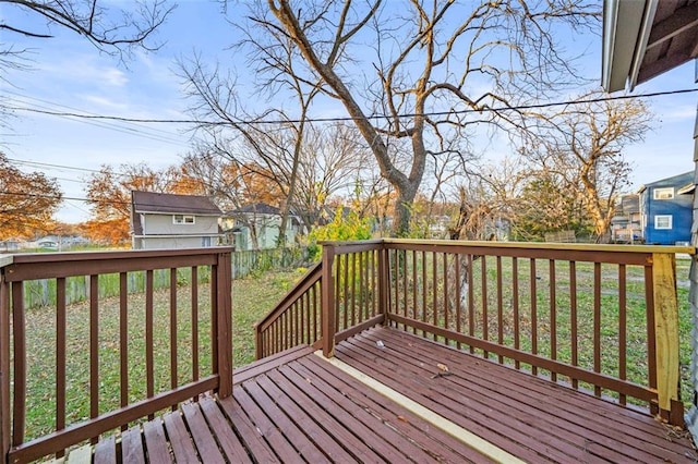 3612 College Ave, Kansas City, MO 64128 - wooden terrace with a lawn