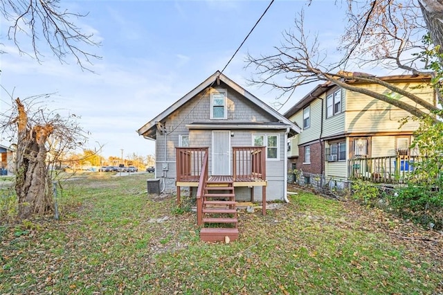 3612 College Ave, Kansas City, MO 64128 - back of property with a deck and central AC unit