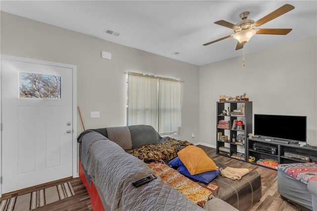 living room with ceiling fan and wood-type flooring