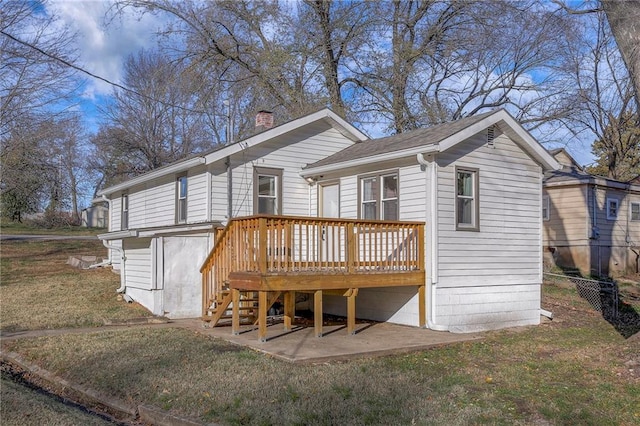 back of house with a patio, a deck, and a lawn