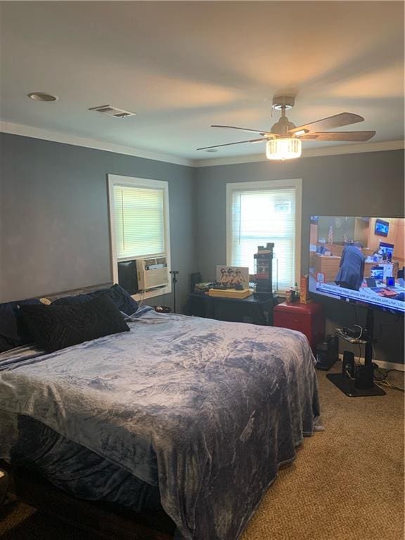 bedroom featuring carpet flooring, ceiling fan, cooling unit, and crown molding