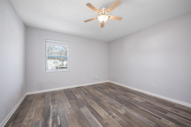 unfurnished room featuring a textured ceiling, ceiling fan, and dark wood-type flooring