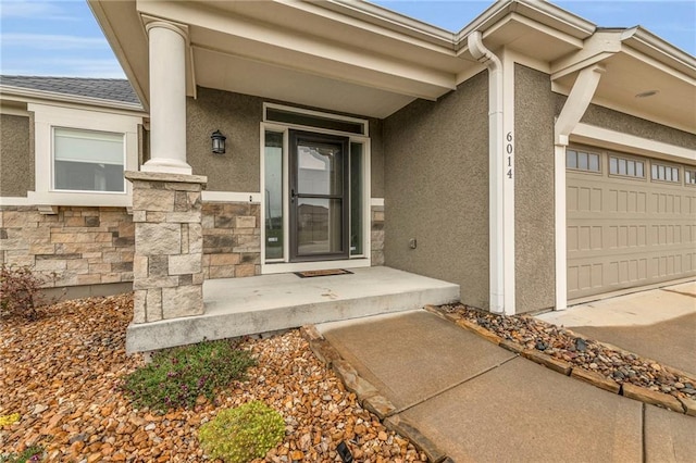 doorway to property featuring a garage