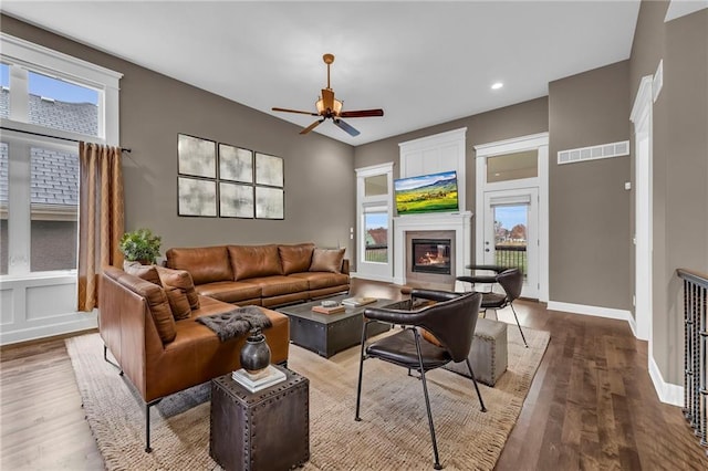 living room featuring ceiling fan and wood-type flooring