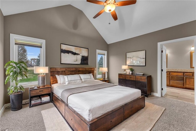 bedroom featuring multiple windows, ceiling fan, and light carpet