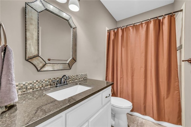 bathroom featuring tile patterned floors, vanity, a shower with shower curtain, and toilet