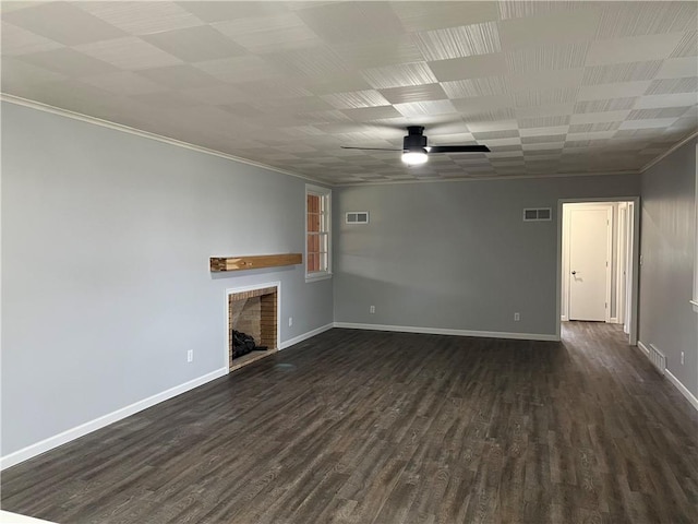 unfurnished living room featuring ceiling fan, dark hardwood / wood-style flooring, and ornamental molding