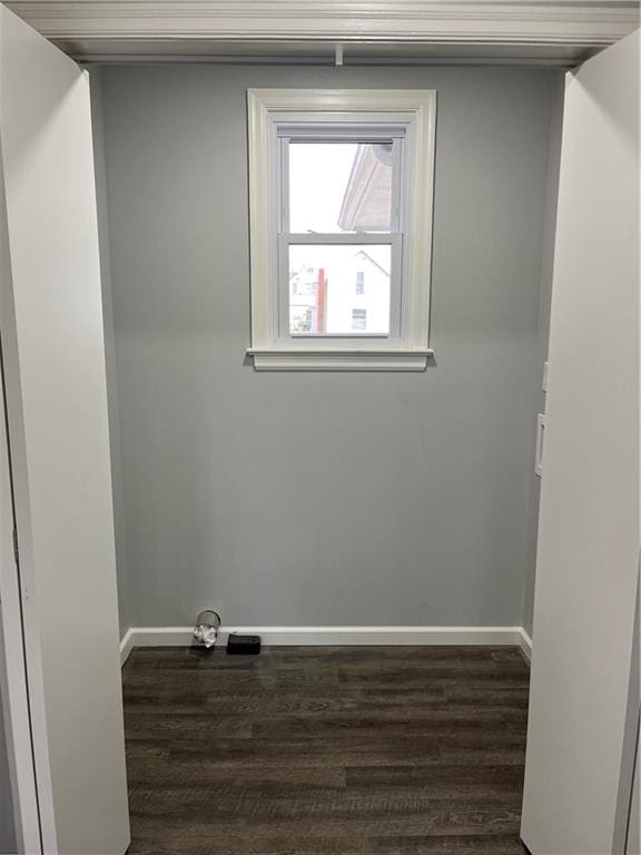 unfurnished room featuring dark hardwood / wood-style flooring