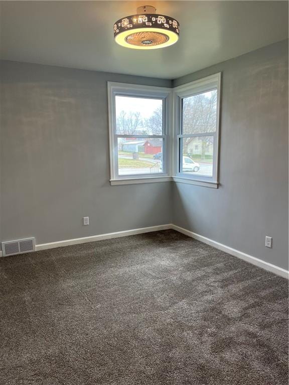 empty room featuring carpet flooring