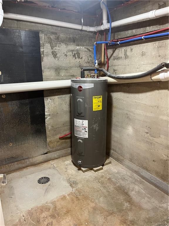 utility room with water heater