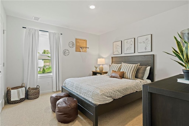 bedroom featuring light colored carpet