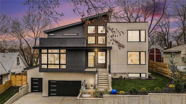 contemporary home with a balcony and a garage