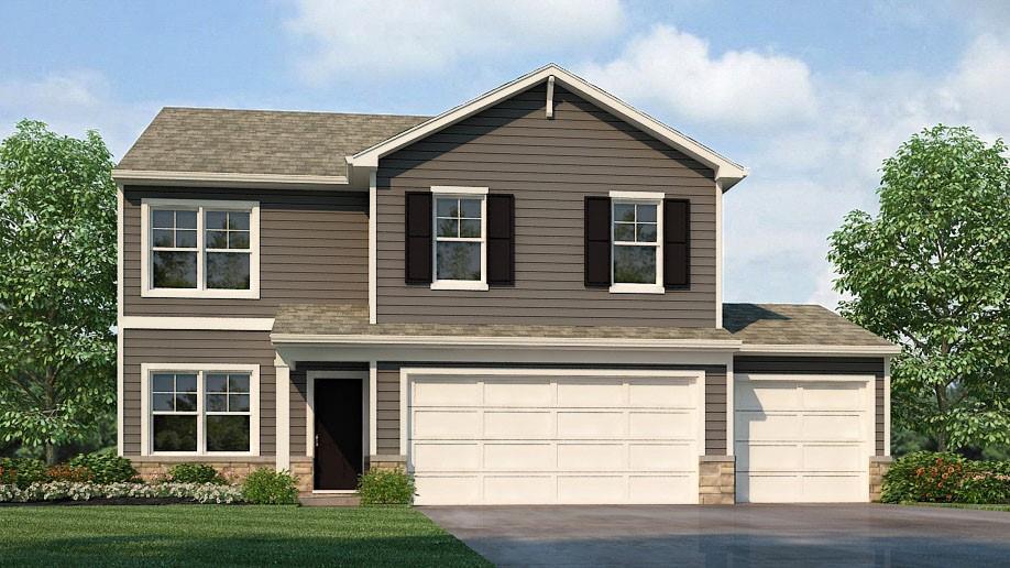 view of front of house featuring a front yard and a garage