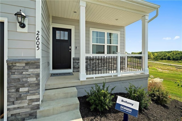 entrance to property with covered porch