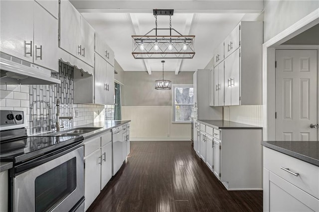 kitchen featuring stainless steel range with electric stovetop, decorative light fixtures, dark hardwood / wood-style flooring, and white cabinetry