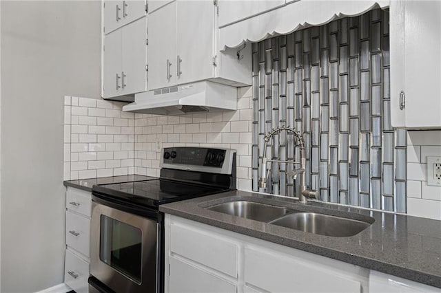 kitchen with decorative backsplash, white cabinetry, stainless steel electric range oven, and sink