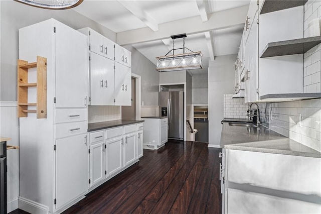 kitchen with sink, tasteful backsplash, stainless steel fridge with ice dispenser, dark hardwood / wood-style floors, and white cabinets