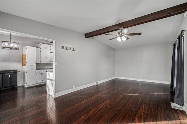 unfurnished living room featuring lofted ceiling with beams, ceiling fan, and dark wood-type flooring