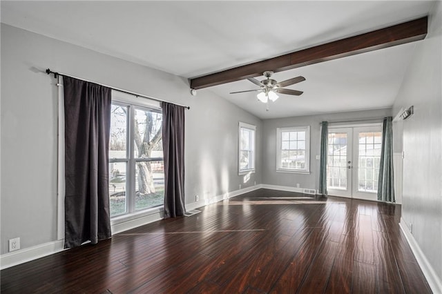 spare room with hardwood / wood-style floors, ceiling fan, french doors, and lofted ceiling with beams