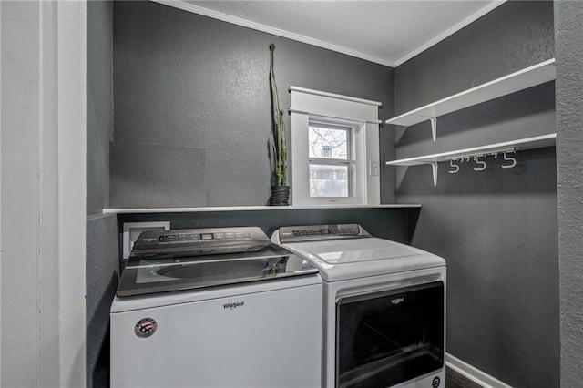 laundry area with washer and clothes dryer and crown molding