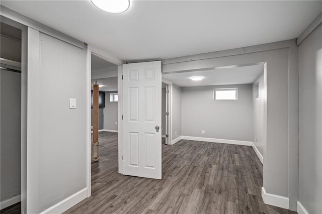 basement with hardwood / wood-style flooring