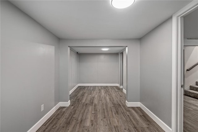 hallway with dark hardwood / wood-style flooring