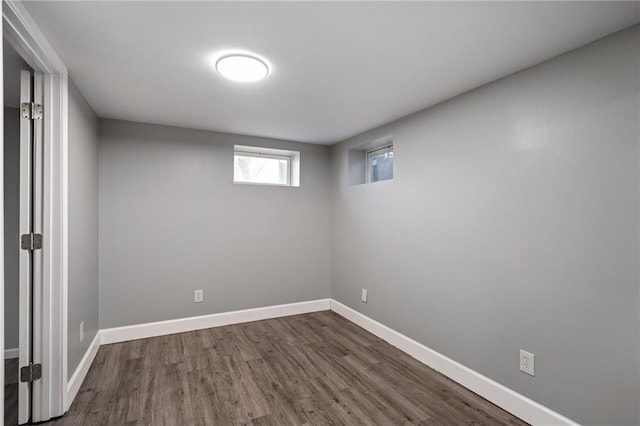 basement featuring dark hardwood / wood-style flooring