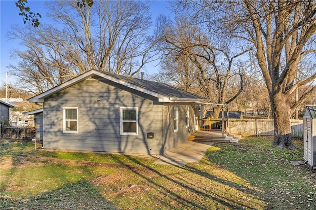 view of property exterior with a lawn