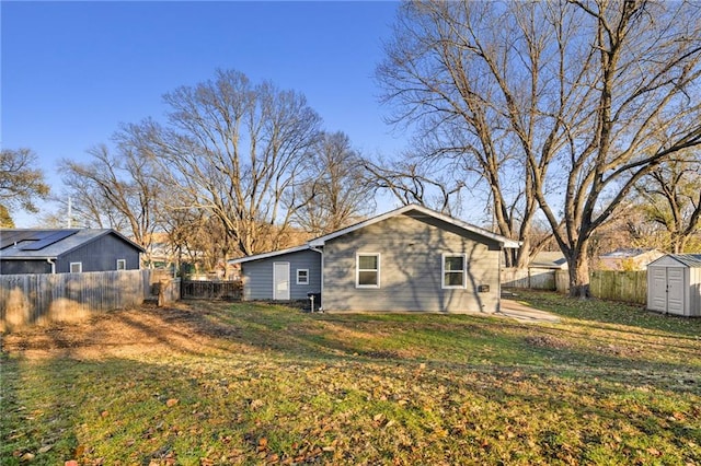 exterior space featuring a storage unit and a yard