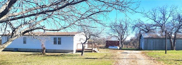 view of home's exterior featuring a lawn