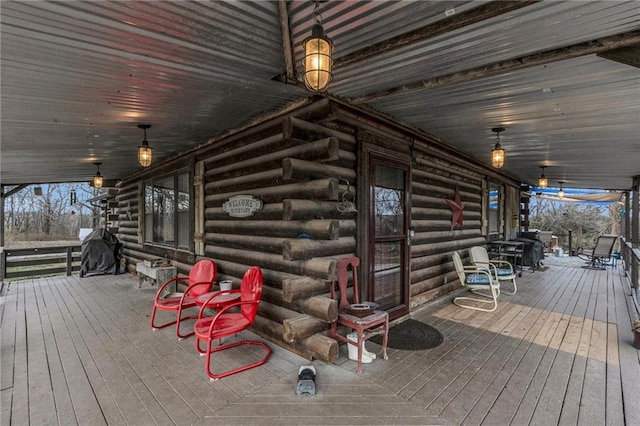 wooden terrace featuring a porch