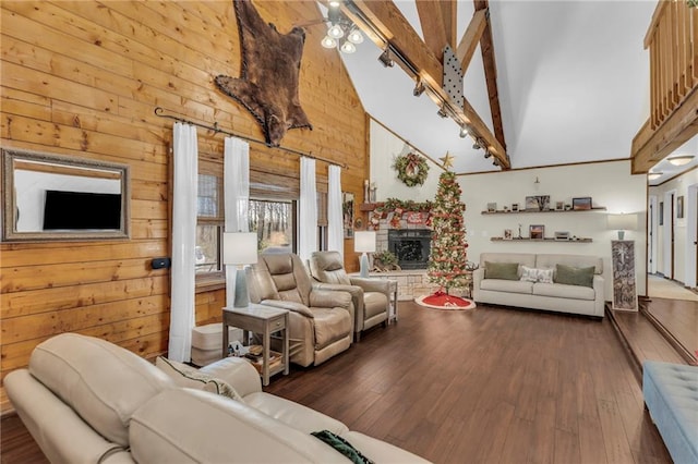 living room featuring dark hardwood / wood-style flooring, a bowling alley, wooden walls, beam ceiling, and high vaulted ceiling