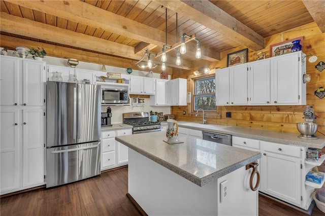 kitchen featuring wooden ceiling, decorative light fixtures, a kitchen island, white cabinetry, and stainless steel appliances