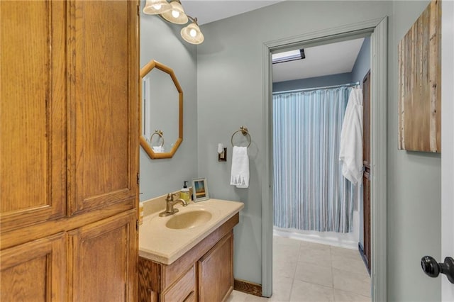 bathroom featuring tile patterned flooring and vanity