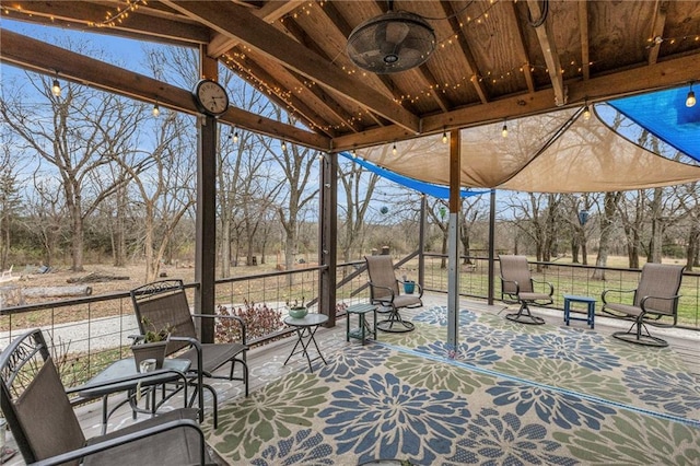 view of patio featuring ceiling fan