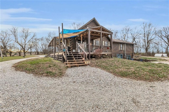 view of front of property featuring a wooden deck