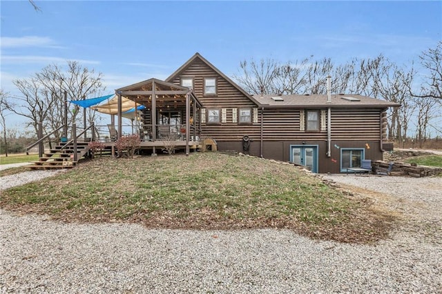 rear view of property with a deck