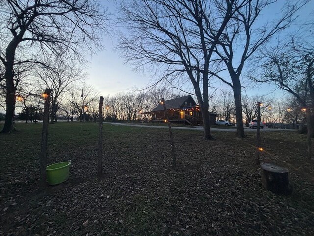 view of yard at dusk