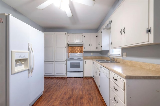 kitchen featuring white cabinets, dark hardwood / wood-style flooring, white appliances, and sink