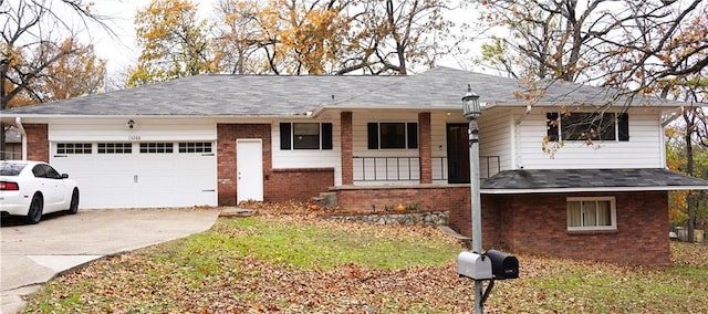 view of front facade with covered porch and a garage