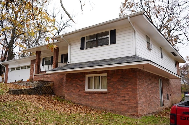 view of side of home featuring a garage