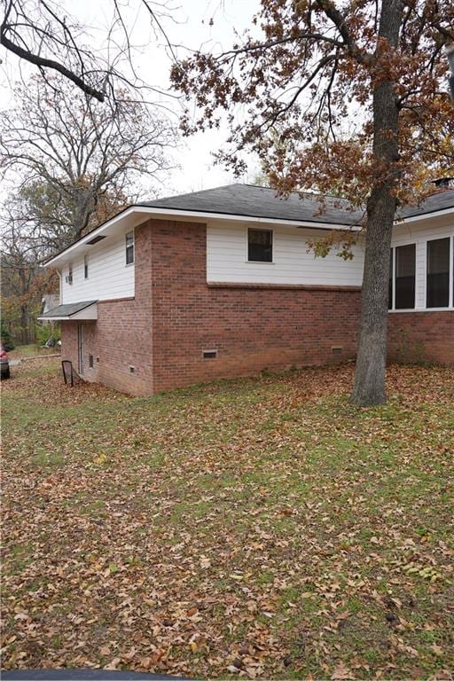 view of property exterior featuring a yard