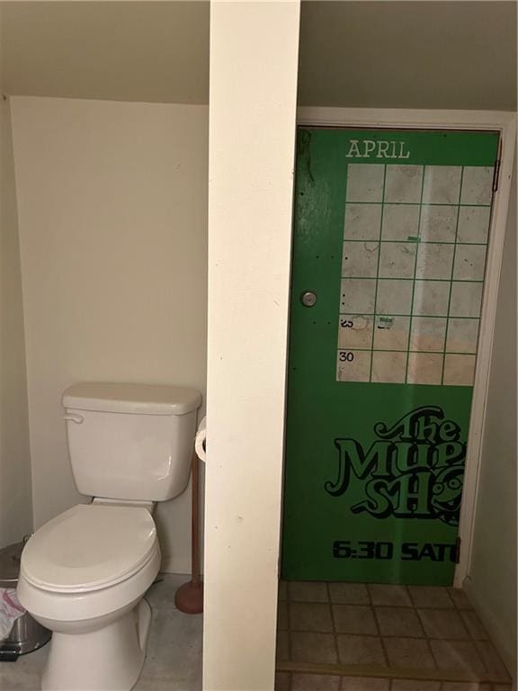 bathroom featuring tile patterned floors and toilet