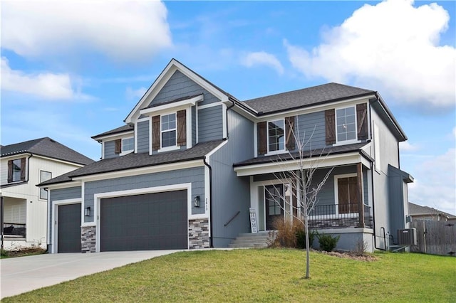 view of front of home with central AC, a porch, a garage, and a front lawn