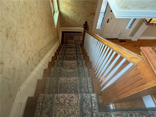 staircase featuring hardwood / wood-style flooring