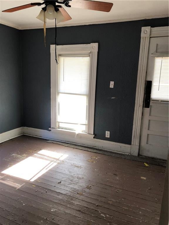 2720 Patee St, Saint Joseph, MO 64507 - spare room featuring ceiling fan, hardwood / wood-style floors, baseboards, and ornamental molding