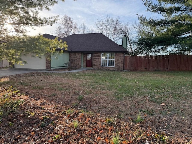 view of front facade with a garage and a front lawn