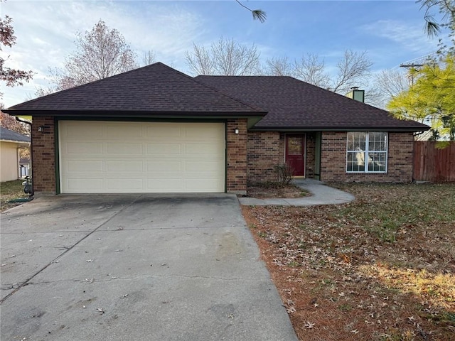 ranch-style home featuring a garage