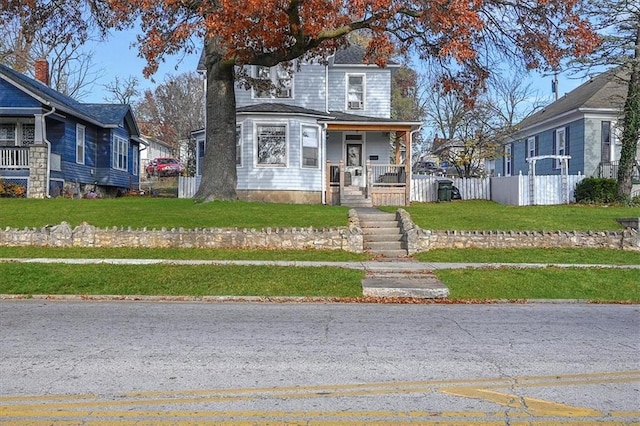 view of front property featuring a porch and a front lawn